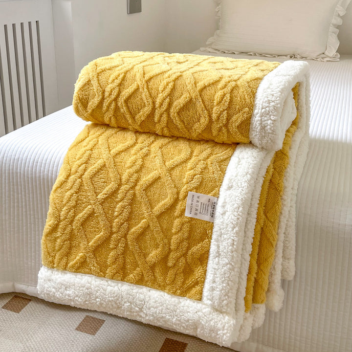 Cream cable knit blanket with sherpa border