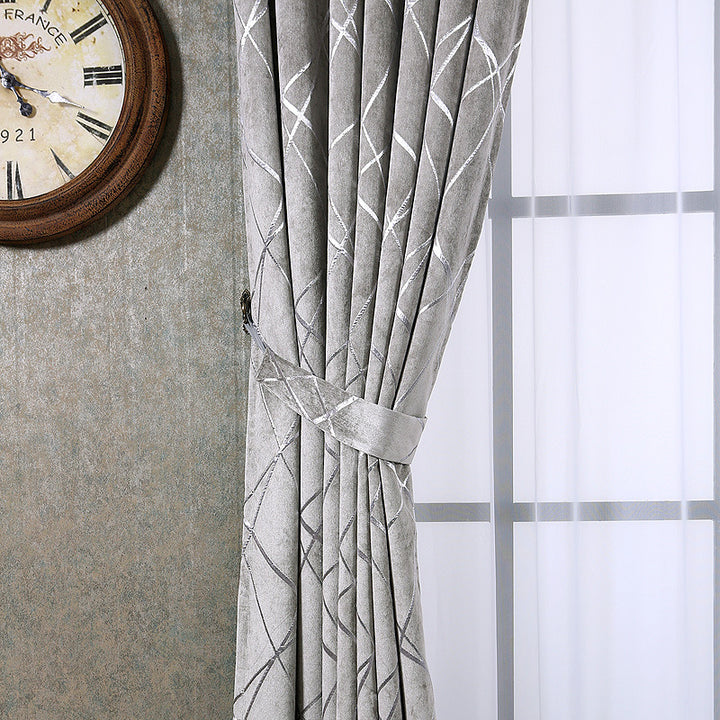 Grey chenille blackout curtain at window