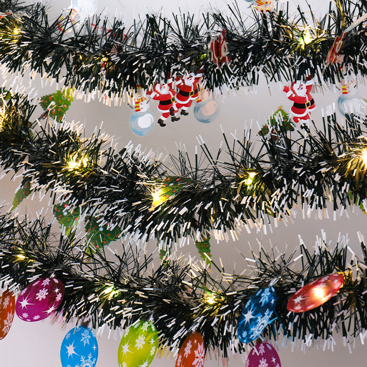 Tinsel Christmas garland with lights and Santas