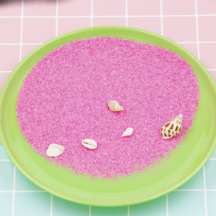 Coloured magic sand shaped underwater