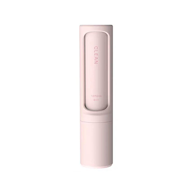 Pet hair remover brush on grey sofa