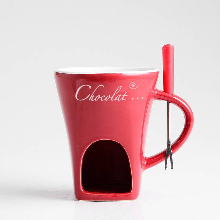 Ceramic fondue mug with fork and tealight