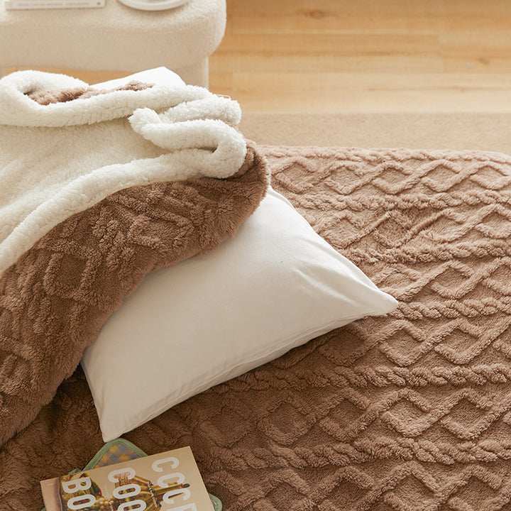 Tufted fleece throw draped over sofa