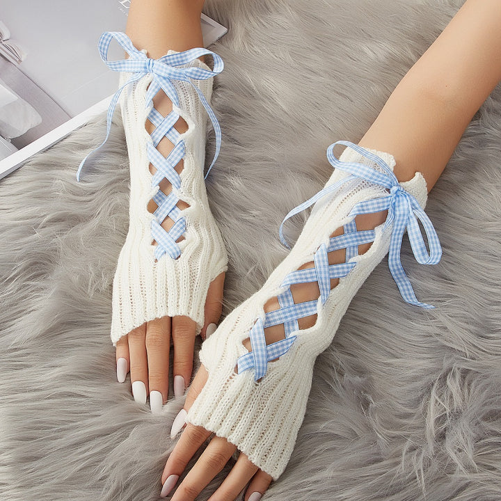 White long fingerless arm warmers with pink ribbon