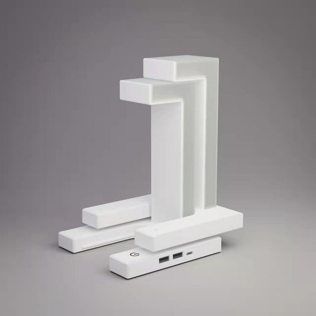 Floating balance lamp with phone on charging base