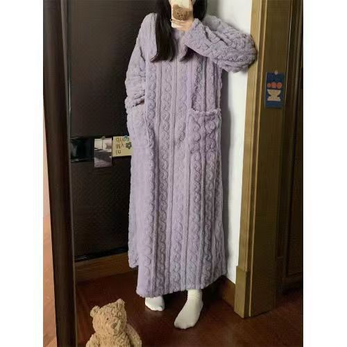 Woman in long pink coral fleece nightgown