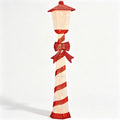 Candy cane striped Christmas lamp post glowing