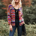 Woman in chunky rainbow striped knit cardigan