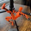 Poseable 3D printed robot figure on desk