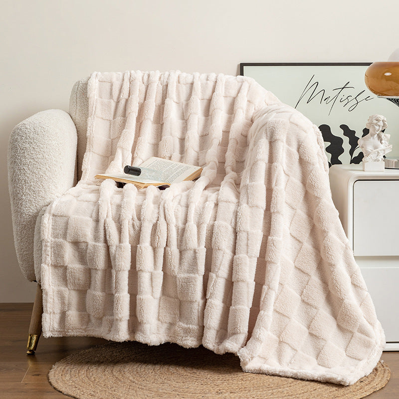 Cream checked plush throw blanket on sofa