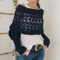 Woman in knitted shrug shawl with sleeves