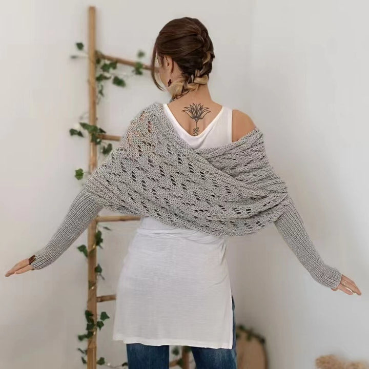 Woman in knitted shrug shawl with sleeves