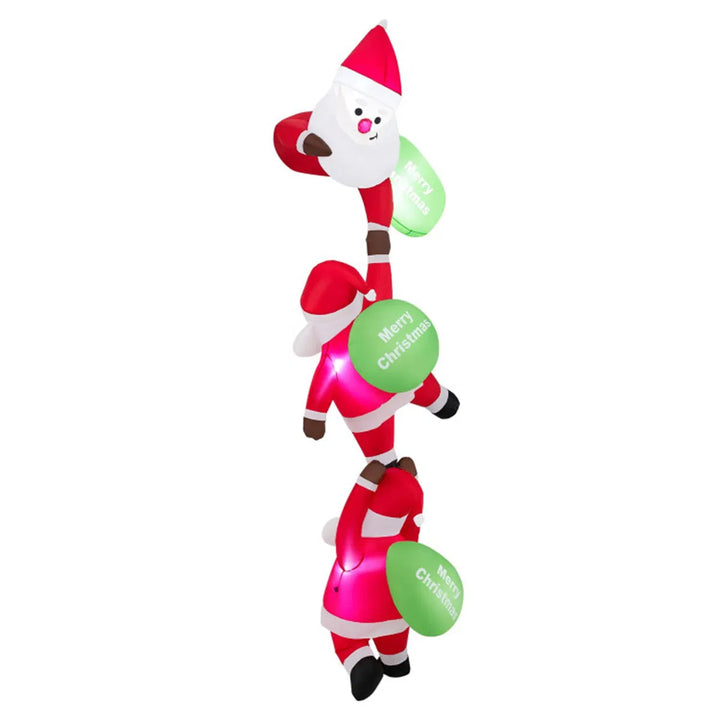 Three inflatable Santas climbing