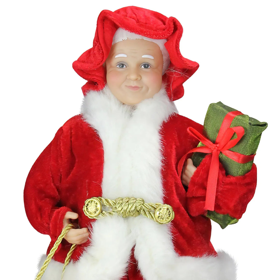 Mrs Claus figure carrying presents