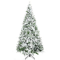 Snow-flocked unlit pine tree