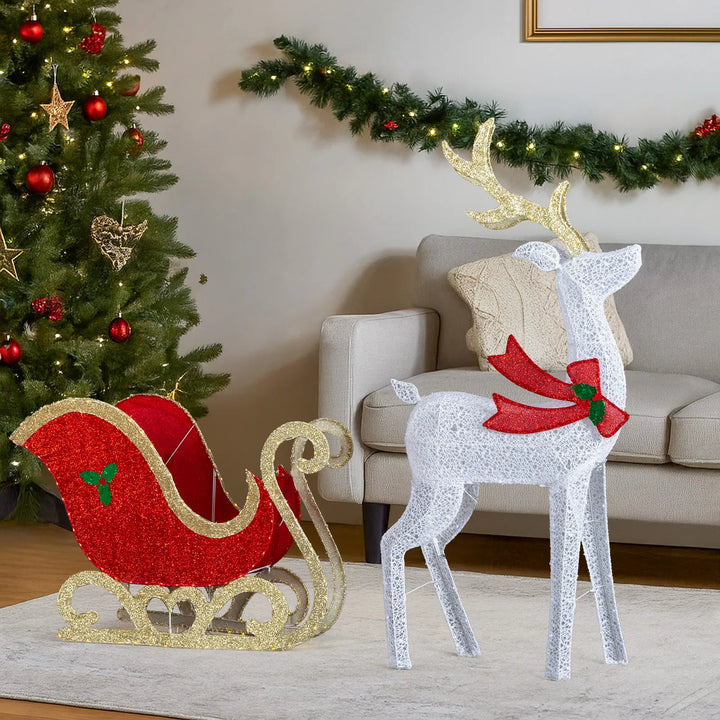 Lit reindeer and sleigh on front lawn