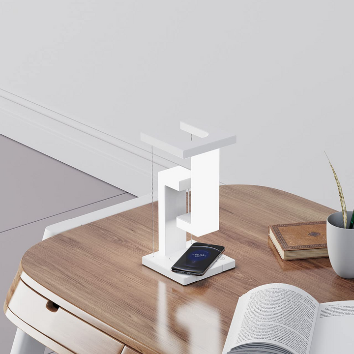 Floating balance lamp with phone on charging base