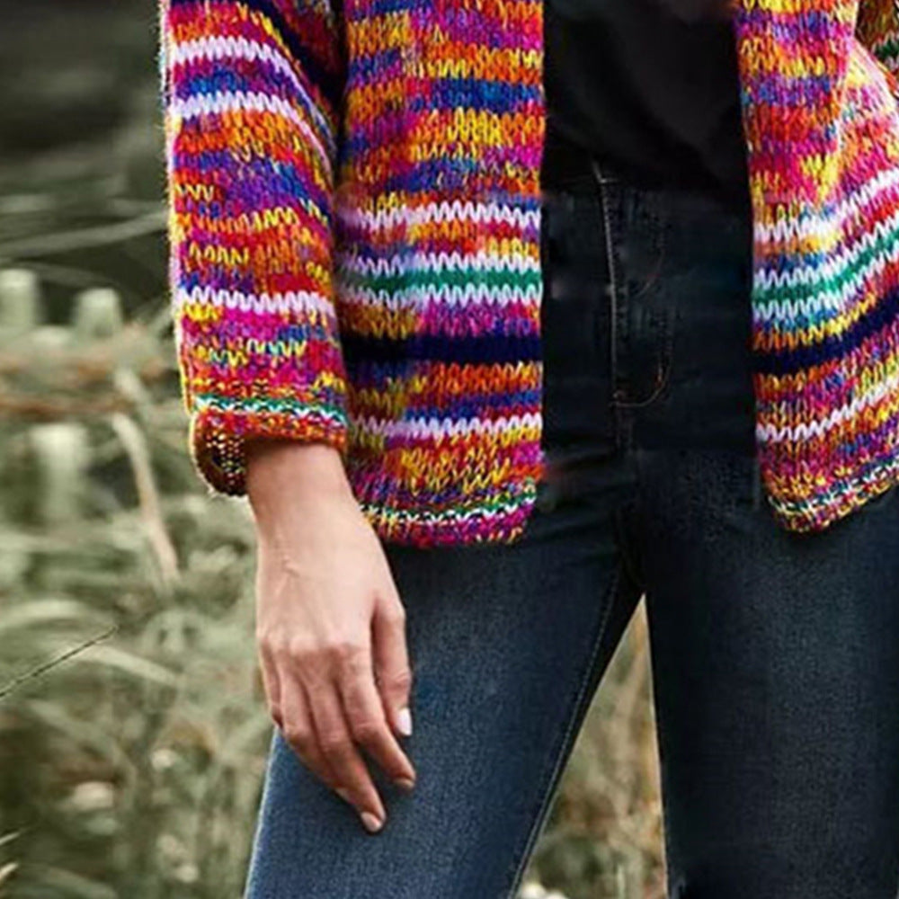 Woman in chunky rainbow striped knit cardigan