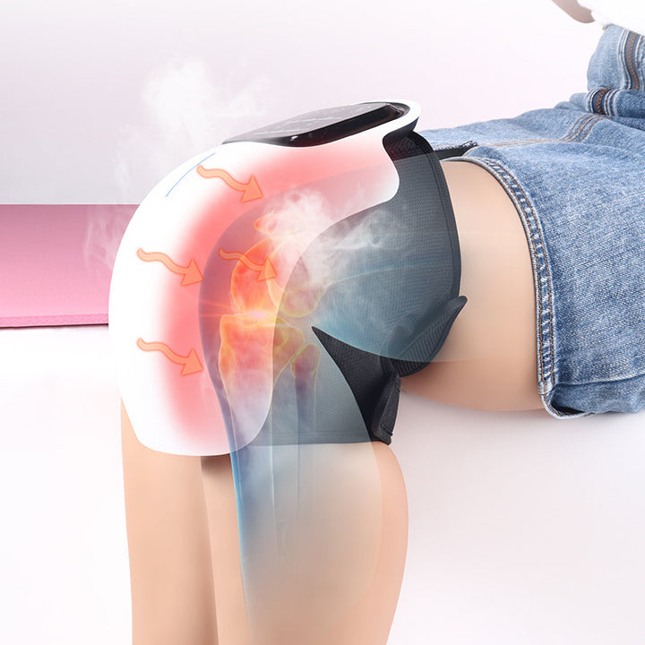 White cordless knee massager wrapped round a knee