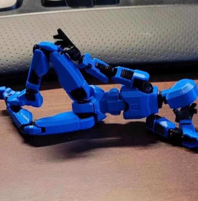 Poseable 3D printed robot figure on desk