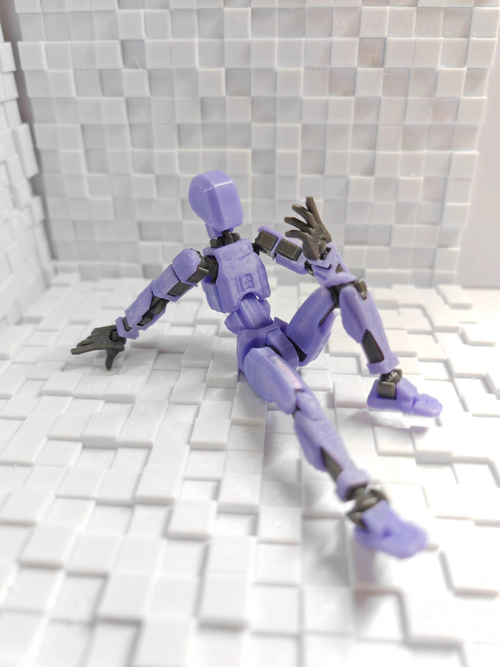 Poseable 3D printed robot figure on desk
