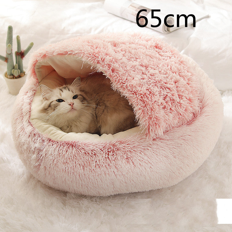 Cat curled in round plush hooded pet bed