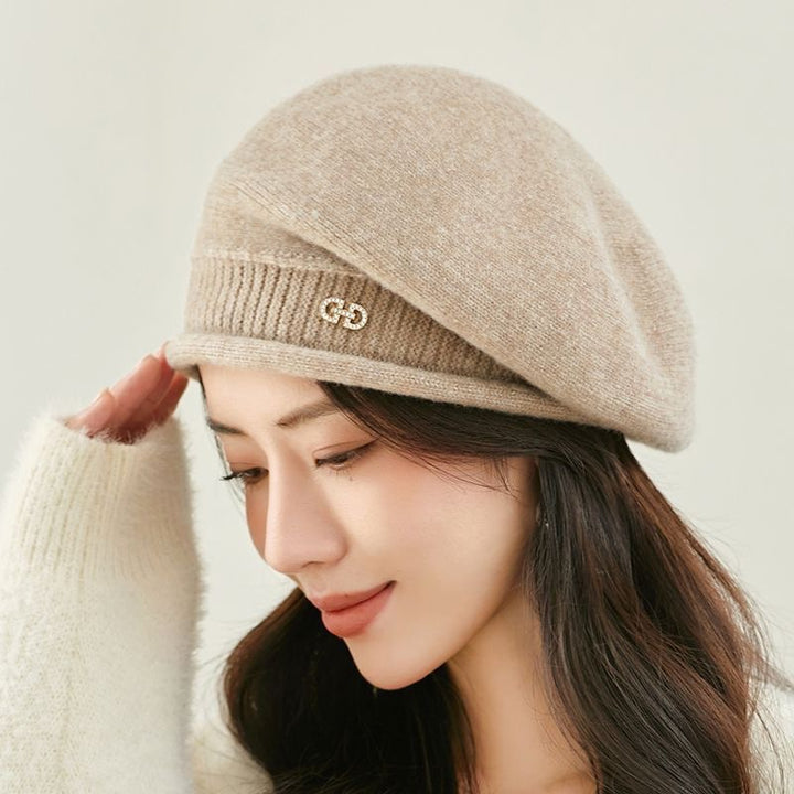 Off-white knitted beret with folded brim