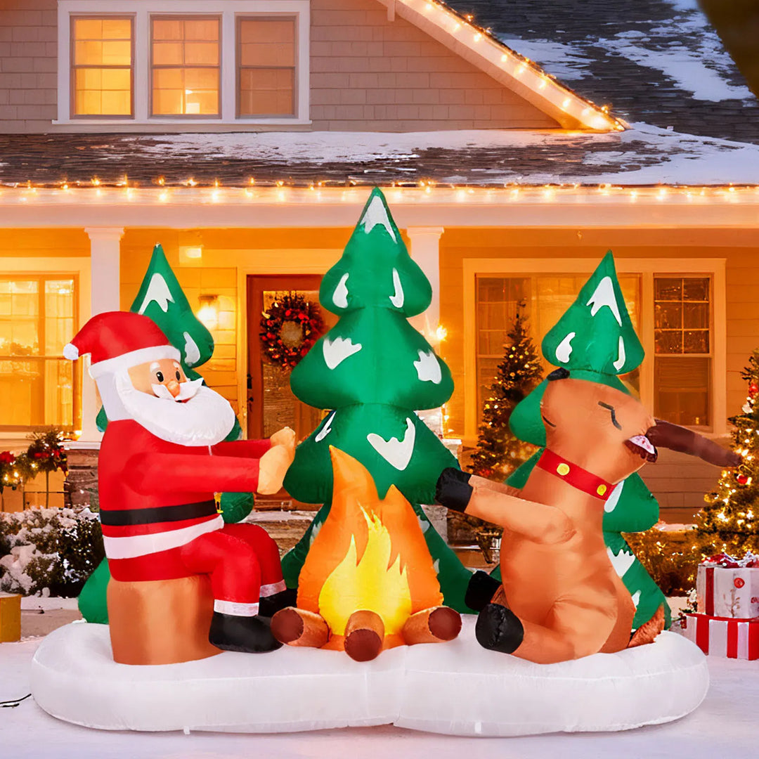 Inflatable Santa and reindeer around campfire