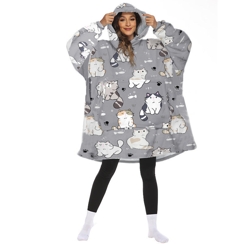 Person wearing oversized panda hooded blanket