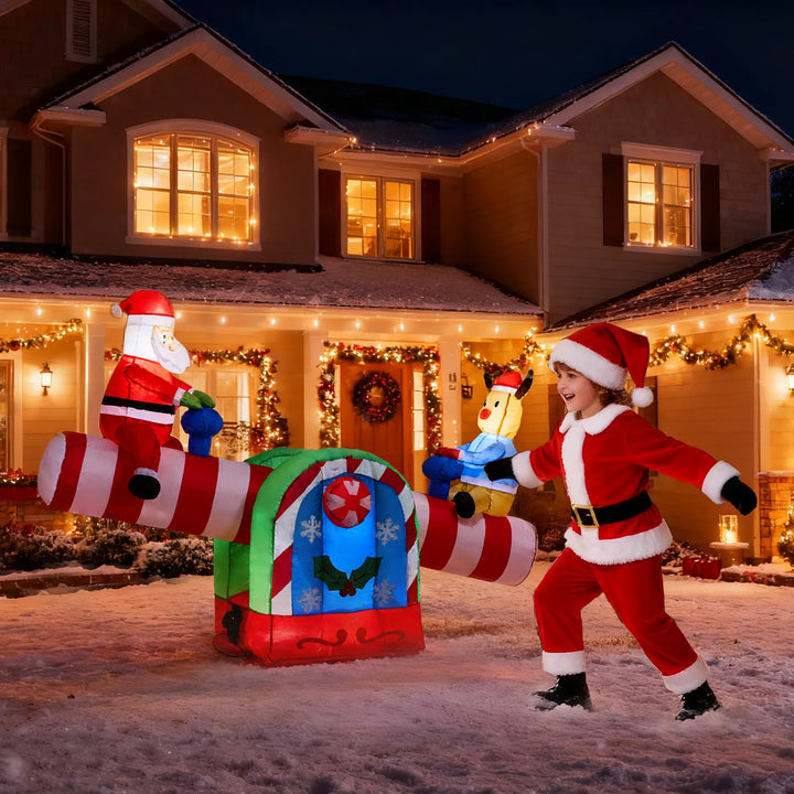 Inflatable Santa and reindeer on seesaw