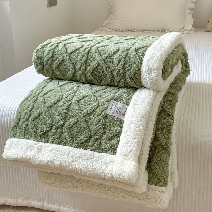 Cream cable knit blanket with sherpa border
