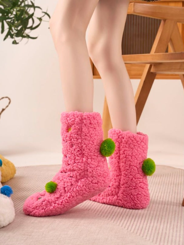 Fluffy yellow socks with embroidered face and pompoms