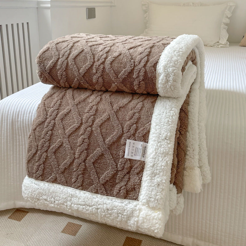 Cream cable knit blanket with sherpa border