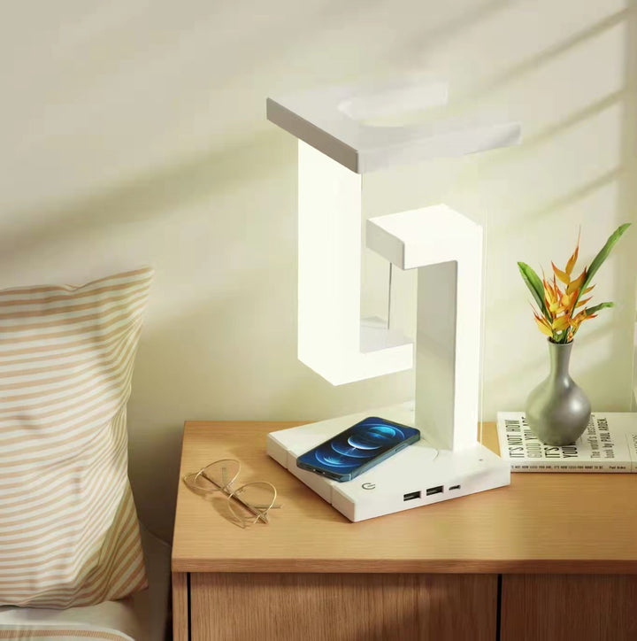 Floating balance lamp with phone on charging base