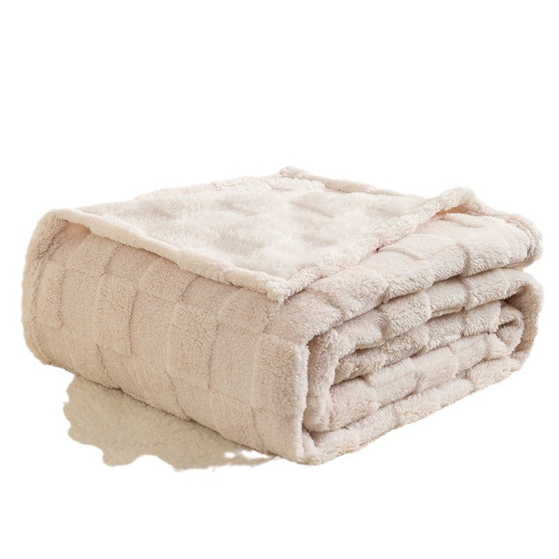 Cream checked plush throw blanket on sofa