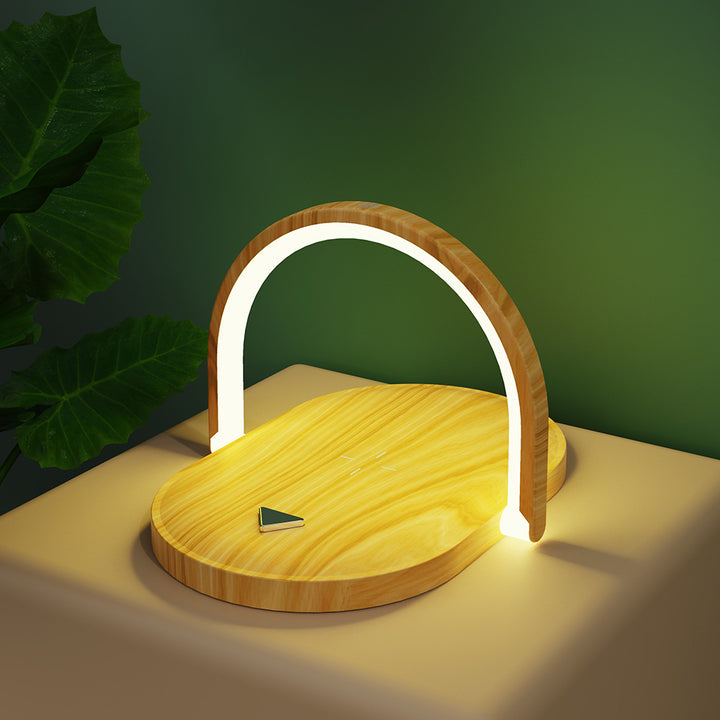 White foldable lamp charging a phone