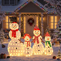 Family of four lit snowman figures