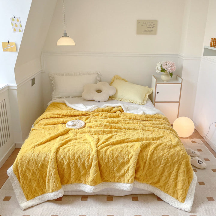 Cream cable knit blanket with sherpa border
