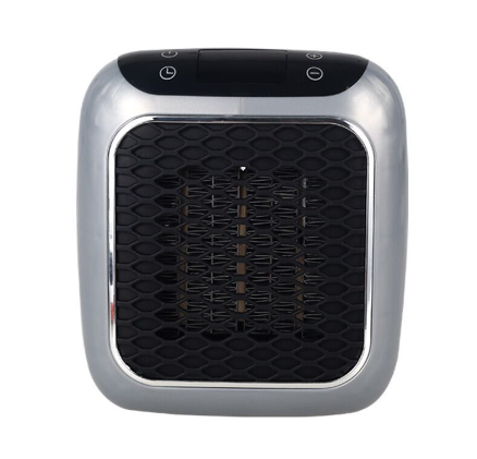 compact grey plug-in heater in a wall socket