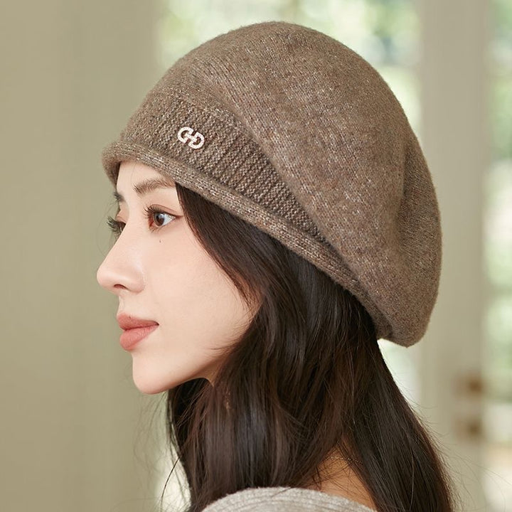Off-white knitted beret with folded brim