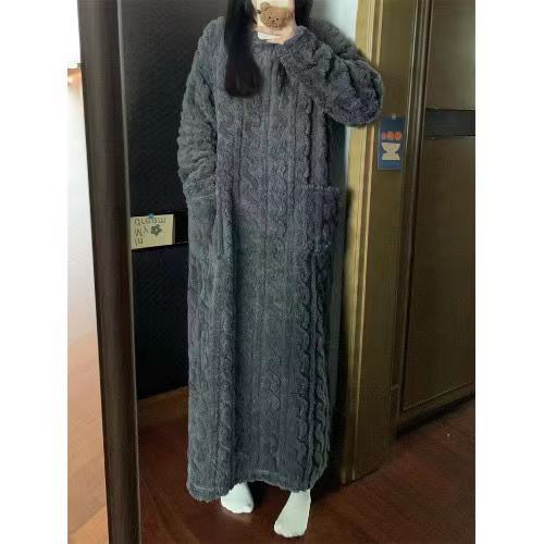Woman in long pink coral fleece nightgown