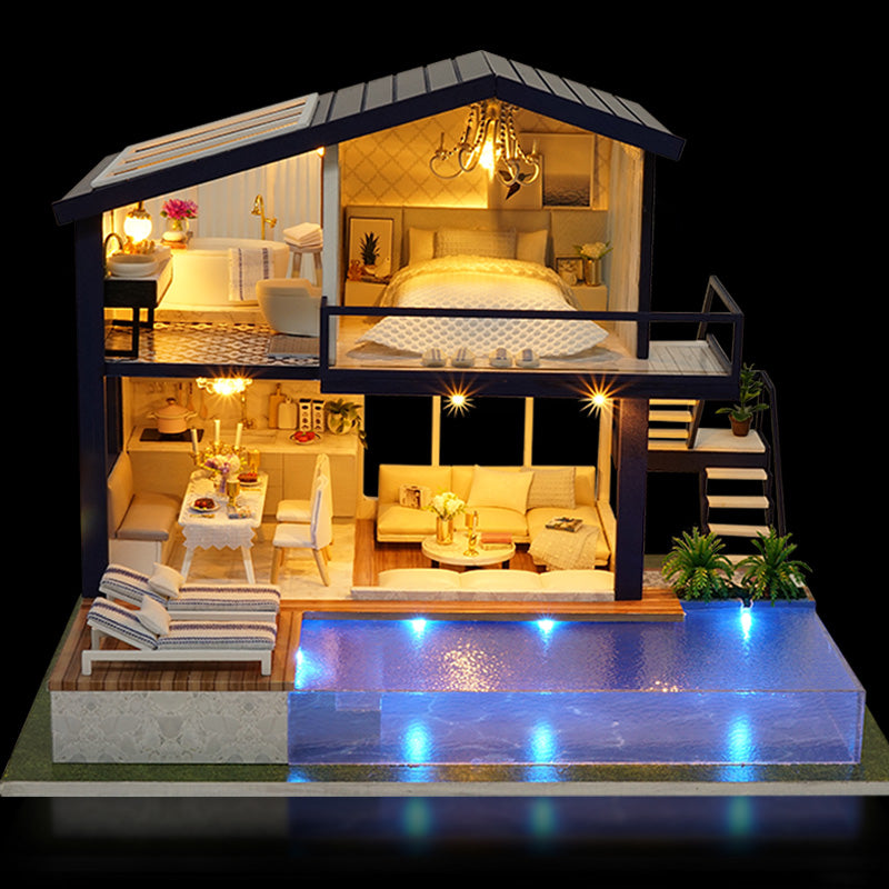 Finished miniature dollhouse with lights on