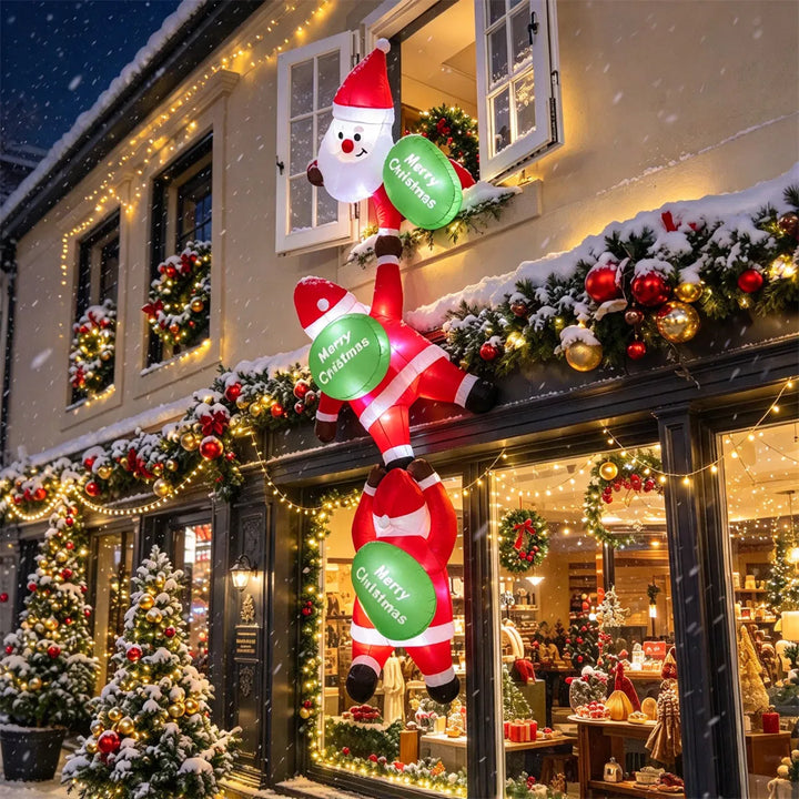 Three inflatable Santas climbing