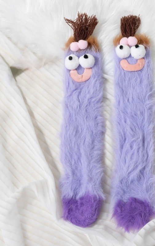 Fluffy pink monster socks with funny face