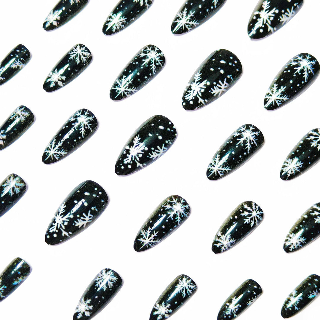 Winter Snowflake Nail Art Design on a Glossy Black Base