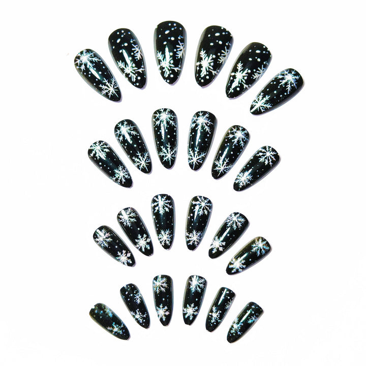 Winter Snowflake Nail Art Design on a Glossy Black Base