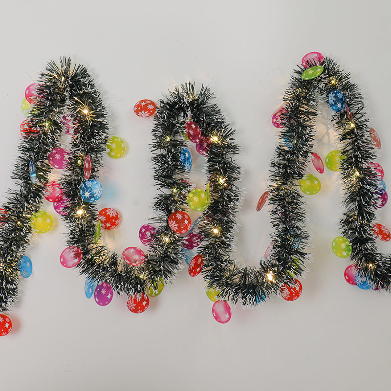 Tinsel Christmas garland with lights and Santas