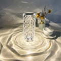 Crystal rose lamp glowing on bedside