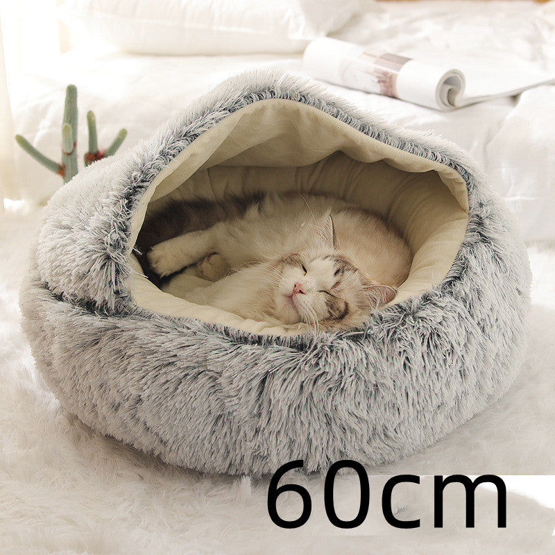 Cat curled in round plush hooded pet bed