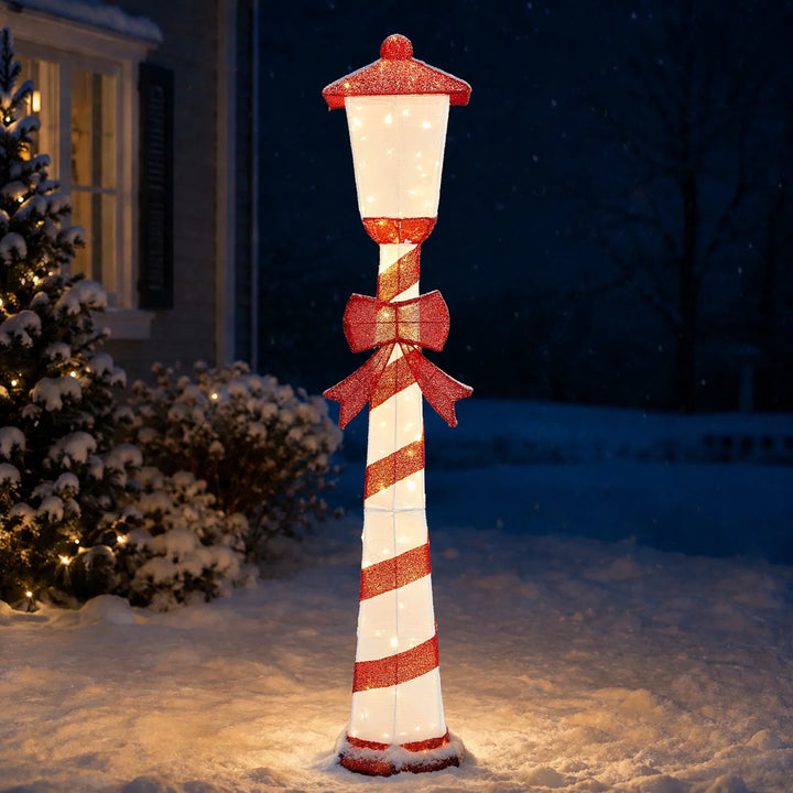 Candy cane striped Christmas lamp post glowing